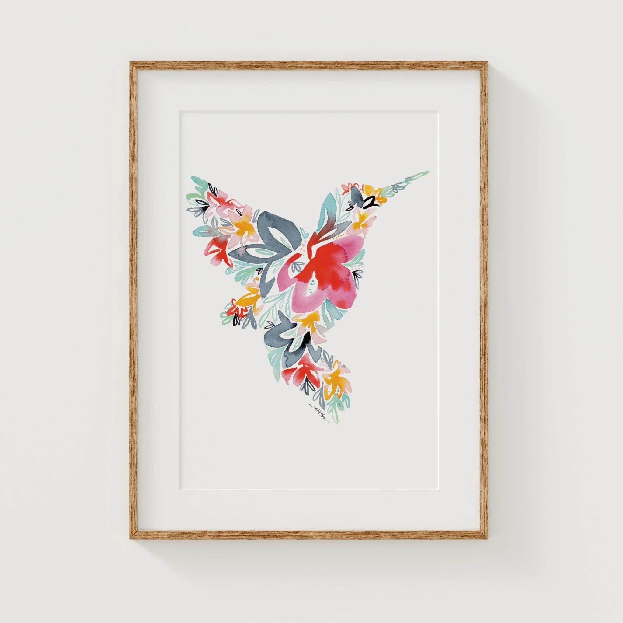 Framed floral watercolor art with vibrant flowers and leaves in a wooden frame