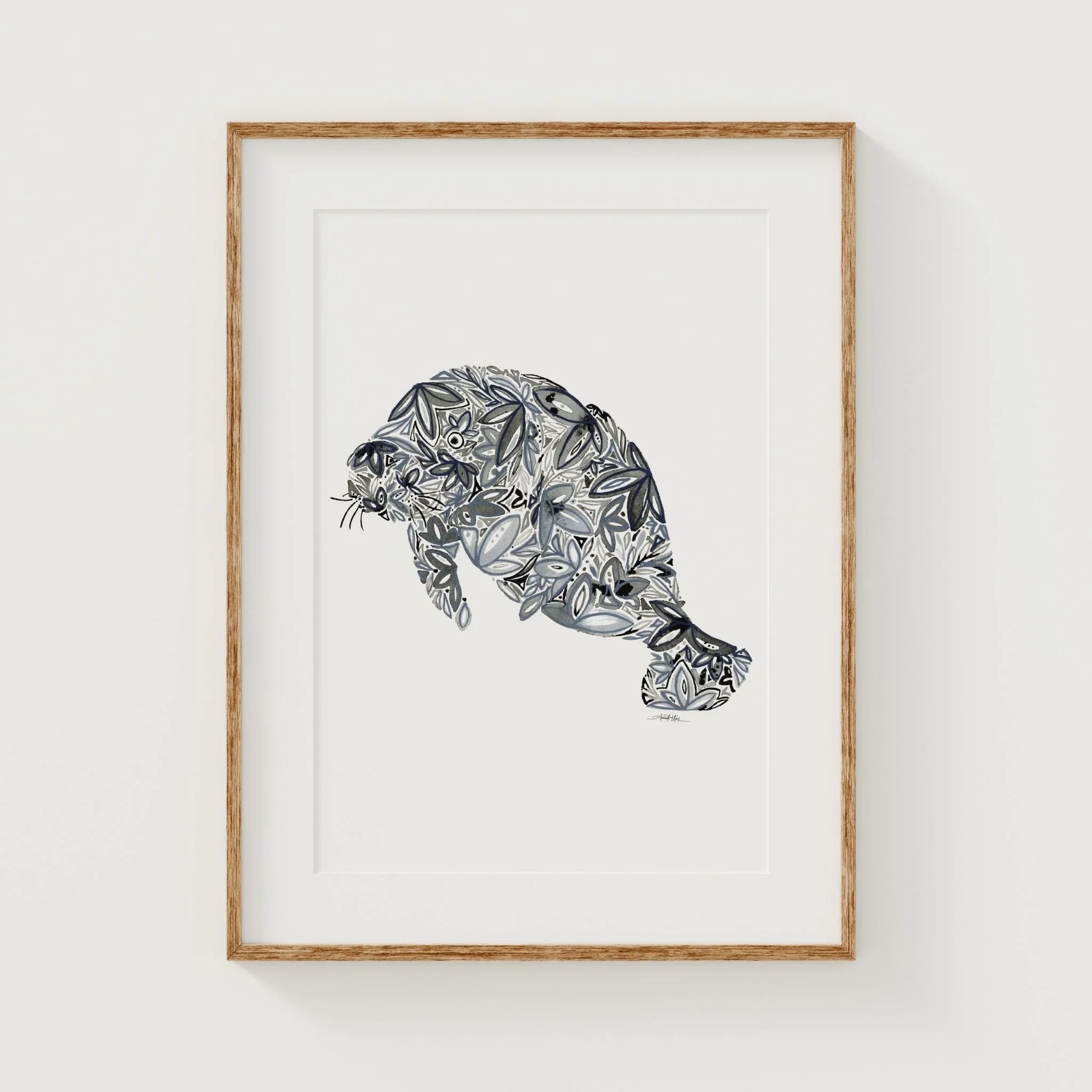 Framed manatee art print with floral pattern, blue-gray tones, wooden frame, wall decor