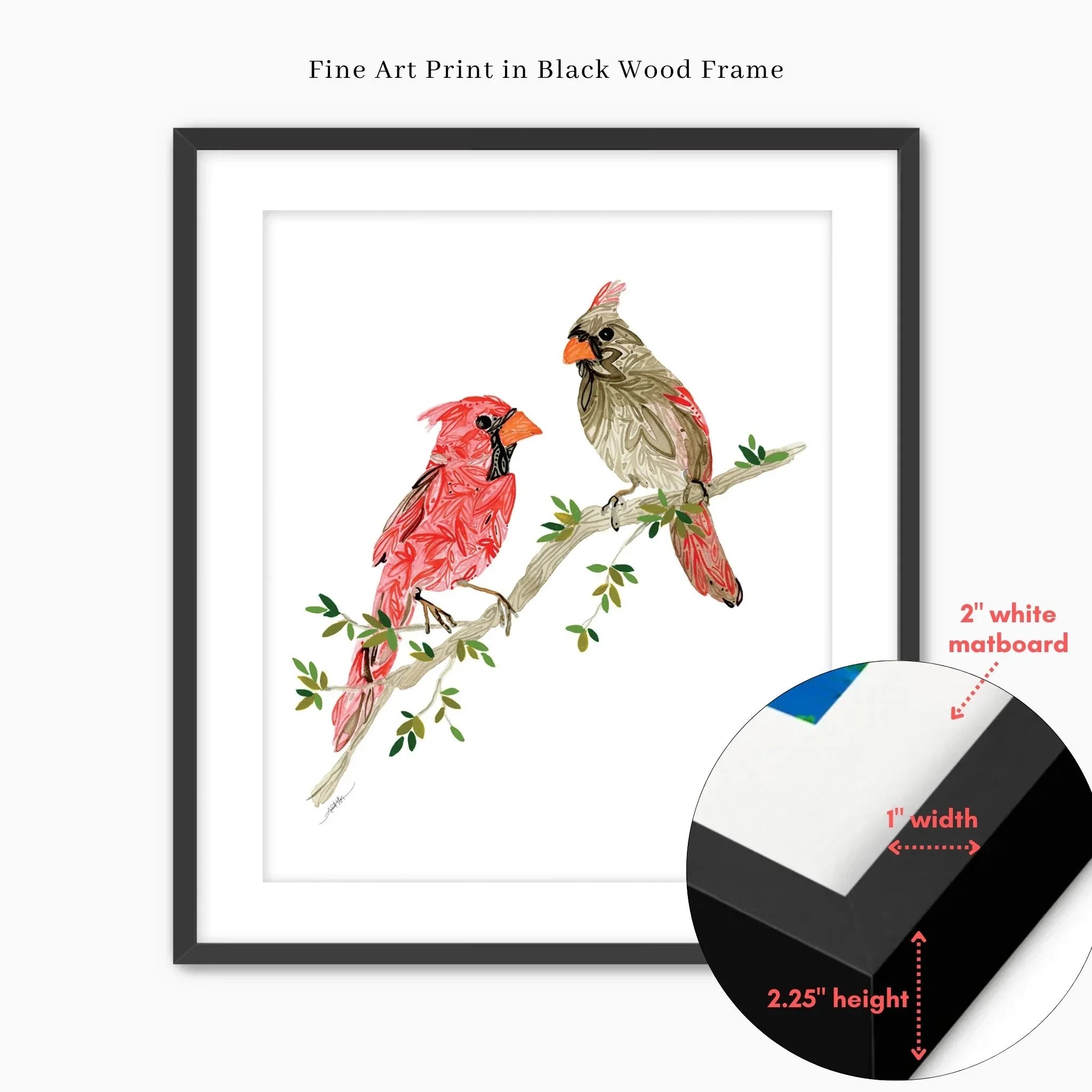 Framed fine art print of two cardinals on a branch, black wood frame with white matboard