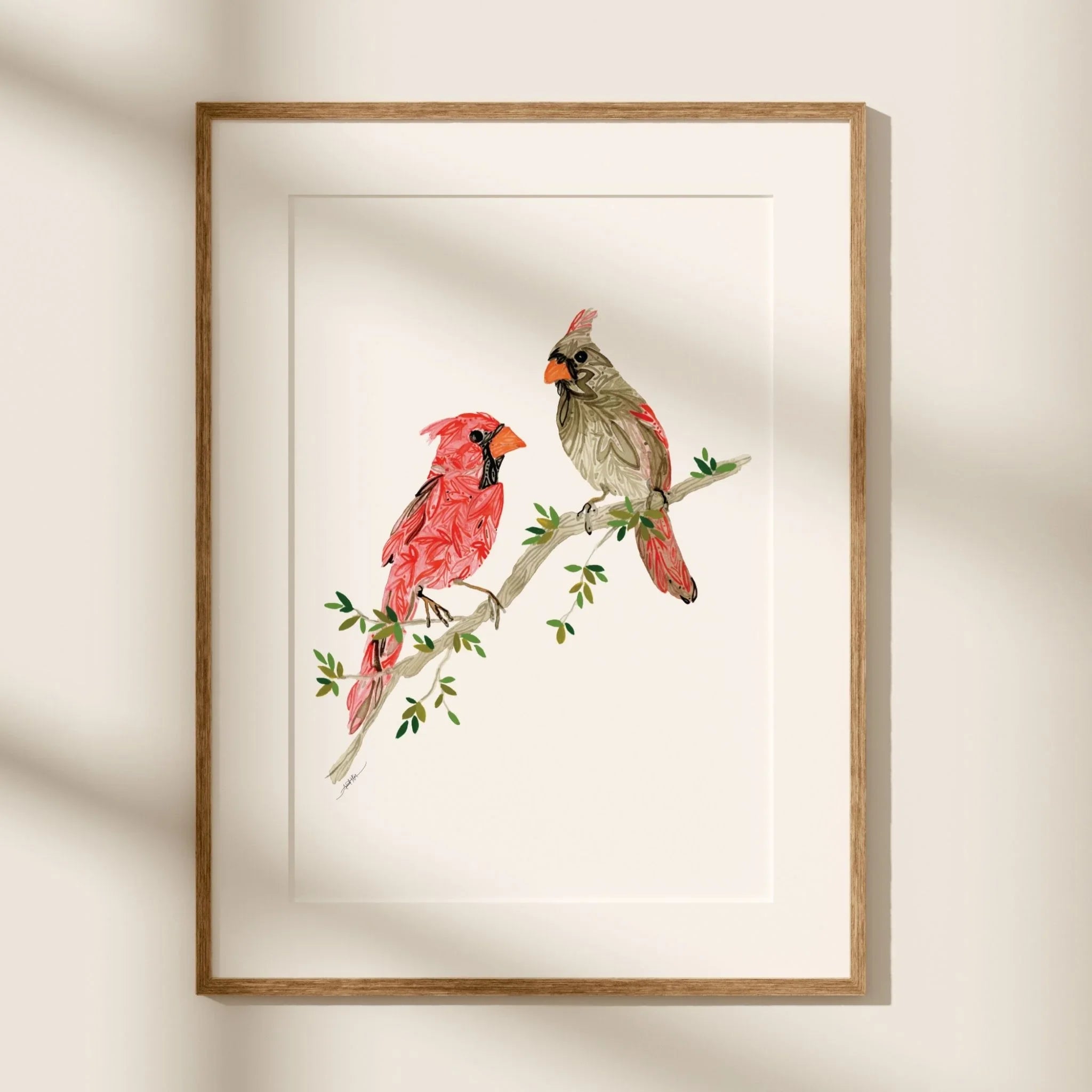 Framed cardinal bird art print with red and gray cardinals on a leafy branch, perfect wall decor