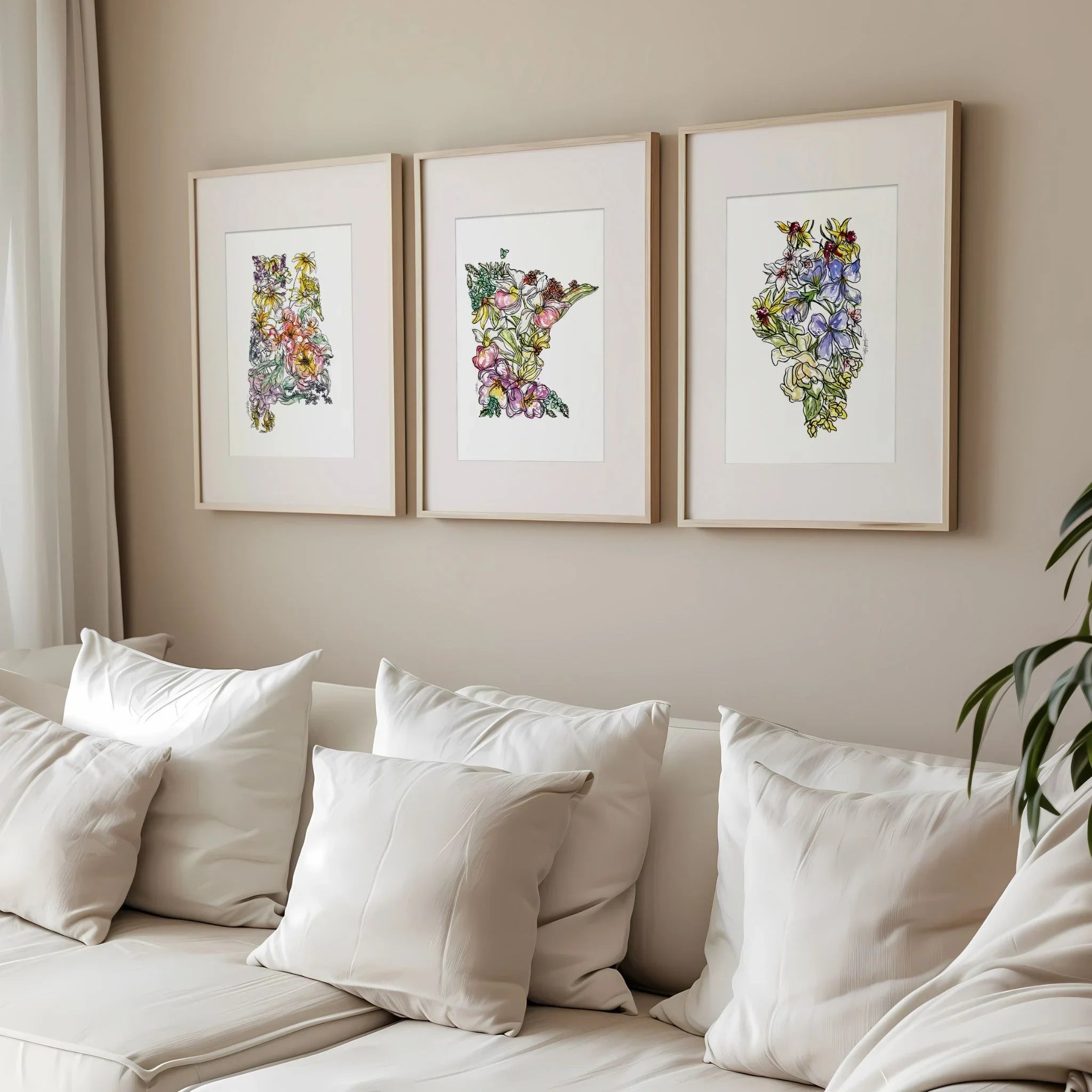 Three framed floral state art prints above a white sofa, perfect for home decor and wall art gifts