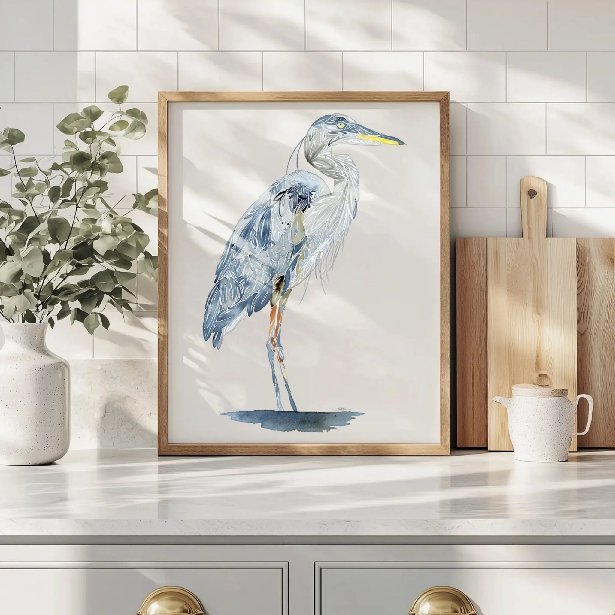 Framed heron watercolor art print for kitchen decor with natural light and greenery